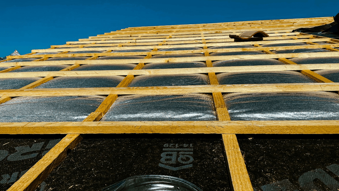 Close-up shot of a damaged commercial roof