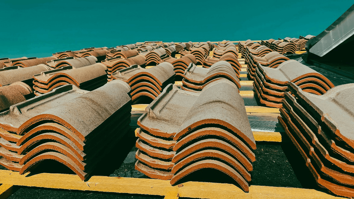 Shingles lying in stacks on a roofing structure 