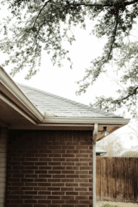a distant shot of a roof with attached gutter system
