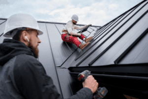 two roofing contractors at work