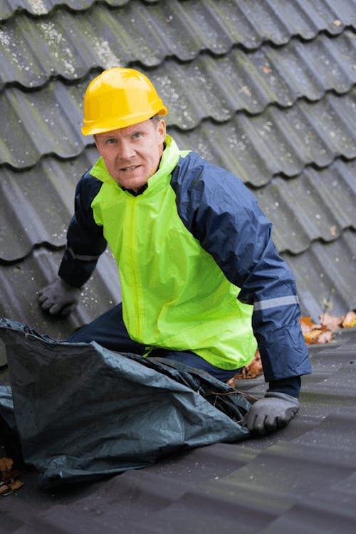 a shot of a roofing contractor at work