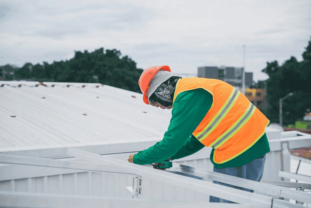 A man inspecting a commercial roof