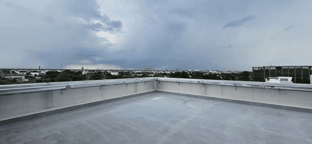 A grey flat roof of a commercial building.