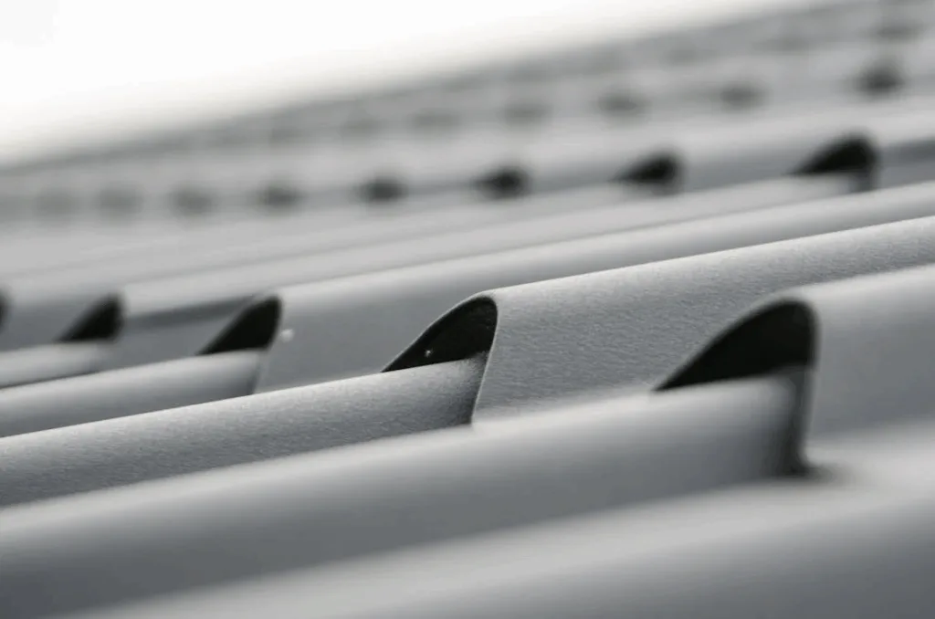 Close-up of a gray metal roof on a commercial building.