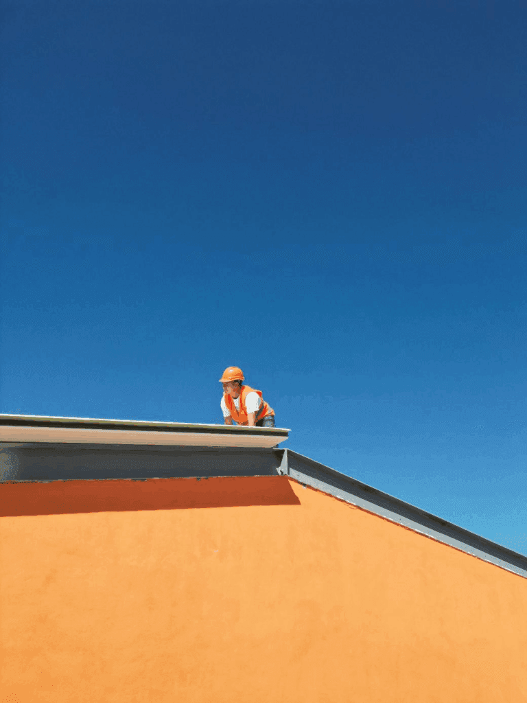 Construction worker on a roof.