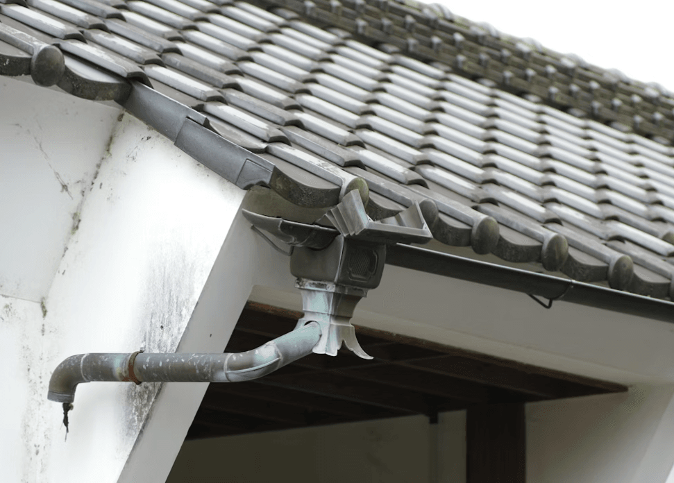 This image shows a grey roof with drainage pipe.