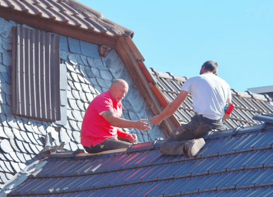 This image shows men working on a roof.
