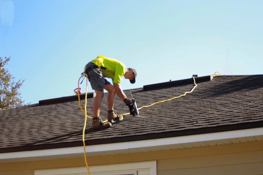 This image shows a man is repairing a roof.