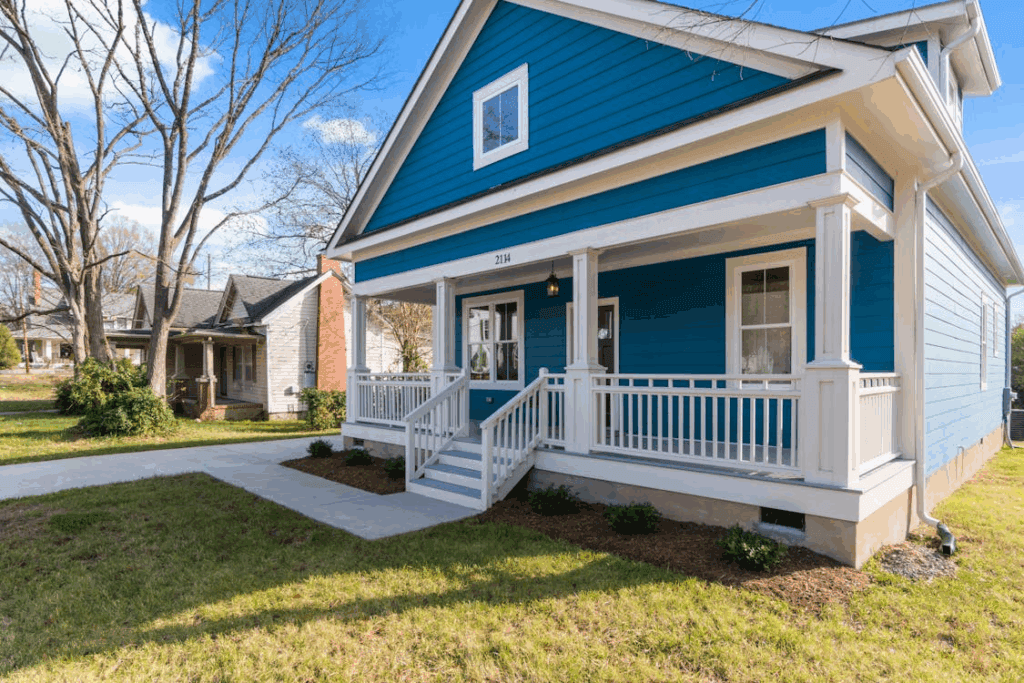 An image of a blue house under the blue sky.